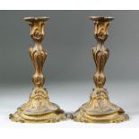A pair of 19th Century gilt bronze candlesticks of Baroque inspiration, with detachable sconces,