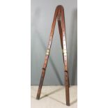 An artist's mahogany three part folding easel, 74.75ins x 7.25ins x 0.75ins (folded)