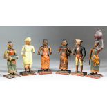 Six Kashmiri painted wood and plaster figures of two men, one holding a sceptre, and four women, two