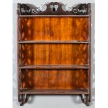 A mahogany four-tier hanging wall shelf in the Chinese Chippendale manner, with fretted sides and