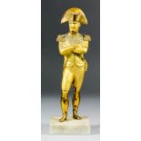 A gilt bronze standing figure of the Emperor Napoleon, his arms crossed, on polished marble base 9.