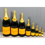 Eight graduated Veuve Clicquot specimen Champagne bottles, from quarter bottle to Nebuchadnezzar