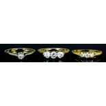 An 18ct gold mounted three stone diamond ring, set with brilliant cut diamonds (each