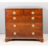 A late George III mahogany chest, the top crossbanded and with moulded edge, fitted two short and