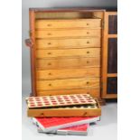 A collectors oak cabinet fitted nine interior drawers enclosed by a single panelled door, 15.5ins