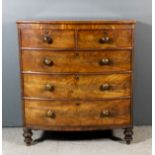 A late George III mahogany bow front chest, fitted two short and three long drawers, on turned feet,