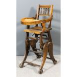 An early 20th Century child's beechwood folding highchair/rocking chair, with moulded rails and