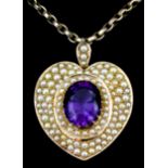 A gold coloured metal mounted amethyst and seed pearl locket, set with central oval facet cut