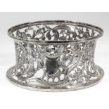 An Edward VII Irish silver dish ring pierced and embossed with shaped cartouche, figures, animals,