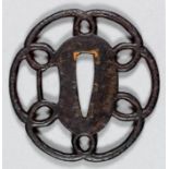 A Japanese Kanayama school iron sukashi tsuba with coiled rope design to rim, 2.75ins (7cm) x 2.