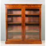 An early 20th Century mahogany bookcase with square edge to top, fitted three shelves enclosed by