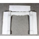 A 19th Century French white marble fire surround of shaped and moulded outline, 41ins wide x 12ins