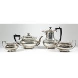 A George V silver rectangular four-piece tea service of bulbous form with gadroon, shell and
