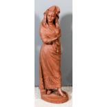 19th Century Continental school - Red terracotta standing figure of a Spanish dancer holding a