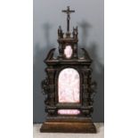 A 19th Century Continental carved walnut framed reliquary tabernacle in the Baroque manner, inset