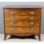 A George III mahogany bow front chest with moulded edge to top, fitted brushing slide and four