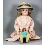 An early 20th Century Simon & Halbig bisque headed doll with closing brown eyes, open mouth