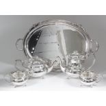 An Elizabeth II silver four-piece tea and coffee service with plain bulbous bodies, shaped and