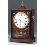 An early 19th Century mahogany cased mantel timepiece, the 4ins diameter enamel dial with Roman