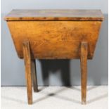 An 18th Century elm dough bin on tapered legs, 32.75ins wide x 18ins deep x 31.5ins high