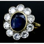 An 18ct gold mounted sapphire and diamond ring, set with central oval cut diamond (approximately
