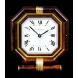 A modern Cartier gilt metal and walnut effect octagonal travelling alarm clock, No. 7517 01440,