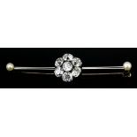 A white and yellow coloured metal mounted diamond and seed pearl bar brooch, the centre set with