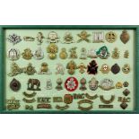 A large collection of military cap badges from various nationalities and regiments, all mounted in