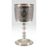 A Victorian silver gilt goblet with moulded rim and part textured cylindrical bowl, with oval