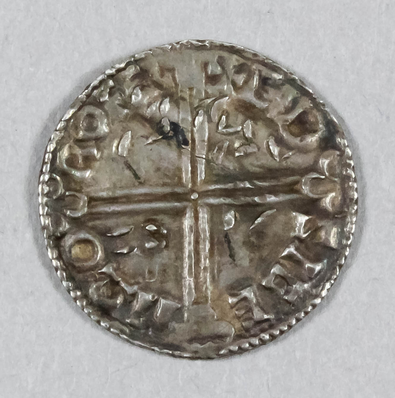 An Aethelred II (978-1016) hammered silver long cross penny, 19.7mm diameter (weight 1.7 grammes)