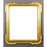 A pair of modern gilt framed rectangular wall mirrors with shaped and moulded frames, inset with