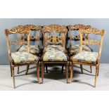 A set of six William IV rosewood dining chairs with bold shaped and carved double scroll crest rails