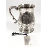 A Victorian silver baluster shaped tankard with bead mounts to rims, engraved with fruit and corn