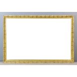 A modern gilt framed rectangular wall mirror moulded with leaf ornament and inset with bevelled