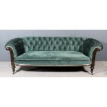 A late Victorian walnut framed three-seat Chesterfield upholstered in bottle green dralon, the