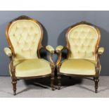 A pair of Victorian walnut framed gentleman's and lady's open arm spoon back easy chairs, the