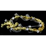 An 18ct yellow and white gold mounted diamond oval brooch by R. H. B., with yellow gold