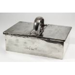 An Edward VII silver rectangular double-lidded cigar box with plain scroll central handle, 10ins x