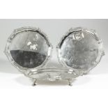A pair of George VI silver circular waiters, the shaped and moulded rims cast with Celtic design, on