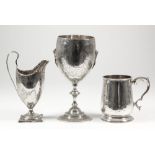 A Victorian silver baluster shaped tankard of "18th Century" design, with moulded rim and footrim