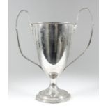 "G. G. F. A. B-League" - A George V silver two-handled cup with moulded rim, reeded and ribbon
