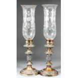 A pair of 19th Century plated pillar candlesticks, with engraved glass shades for same, 19ins