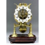 A 19th Century brass framed skeleton clock, the 4.75ins silvered chapter ring with shaped edge and