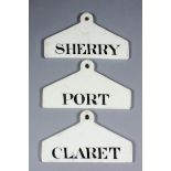 Three 19th Century creamware bin labels of coat hanger shape - "Port", "Claret" and "Sherry", each