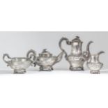 An early Victorian silver three-piece tea service, the circular squat bodies with moulded rims,