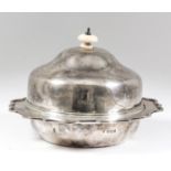 A George V silver circular muffin dish liner and cover, the domed cover with turned ivory finial and