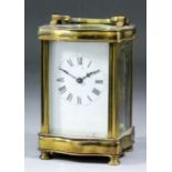 An early 20th Century French carriage timepiece, the white enamel dial with Roman numerals, to the