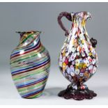 An Italian "Murano" glass ewer, the body with multicoloured cane decoration, mauve patterned glass