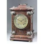 A late 19th Century German oak and brass mounted cased mantel clock by Winterhalder & Hofmeier,