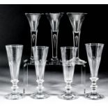 Three 18th Century wine glasses with drawn trumpet bowls on plain stem with teardrop above a plain